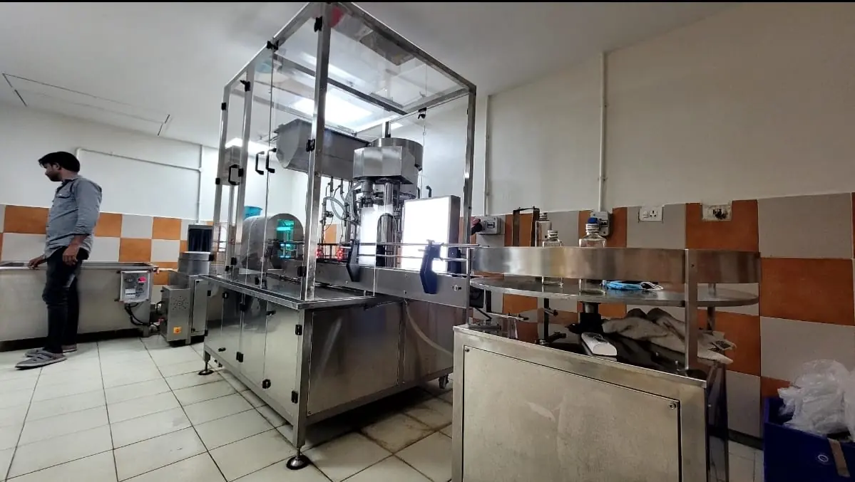 Glass bottle filling and capping line project by Umang Systems
